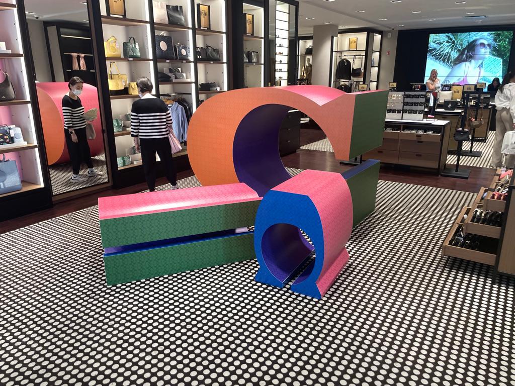 Colorful retail display fixtures in boutique interior.